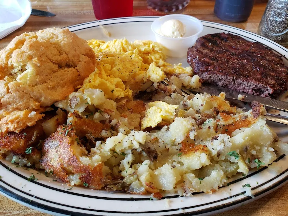 Bison Patty Scrambled Eggs Home Fries and a Fluffy Biscuit
